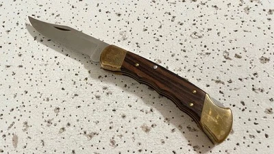 Cuchillo Buck U.S.A. de colección 110X mango de madera de ébano cuchillo de bolsillo plegable liso Foto 1 de 4