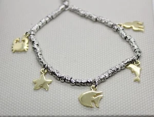 BRACCIALE ARGENTO DONNA DODO STYLE LINEA MARE RODIATO E CHARMS DORATI CM 18 - Foto 1 di 5