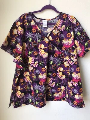 WOMEN'S DISNEY HALLOWEEN CHESHIRE CAT V NECK MOCK WRAP SCRUB TOP SIZE 3 XL NWT - Image 1 of 4