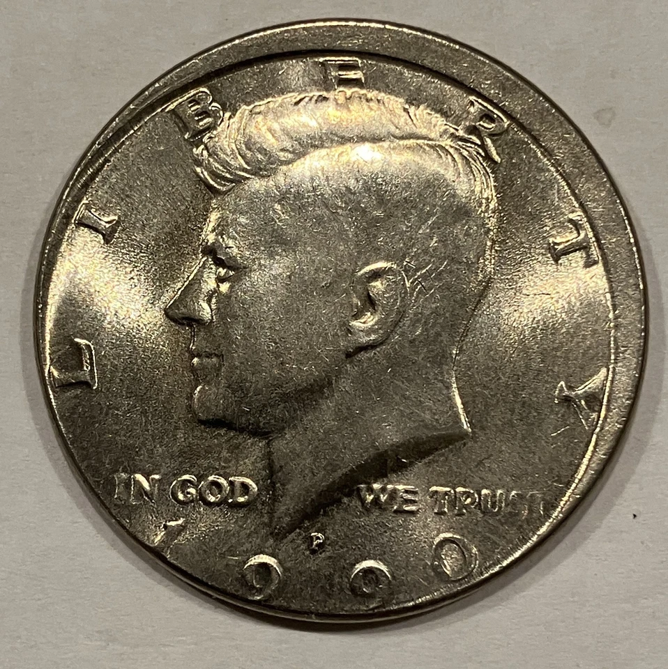 1990 P KENNEDY HALF DOLLAR O/C BROADSTRIKE  BU GEM F1022-1 - Image 1 of 3