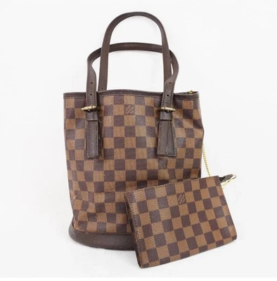 Auténtico cubo Louis Vuitton Damier Level PM con bolsa  Foto 1 de 4