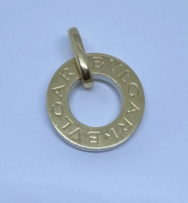 Colgante circular Bvlgari oro 18k emblema Bulgari etiqueta de perro acero inoxidable Foto 1 de 4