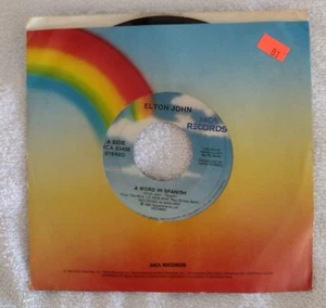 Elton John 45 RPM Single A Word In Spanish - Picture 1 of 4