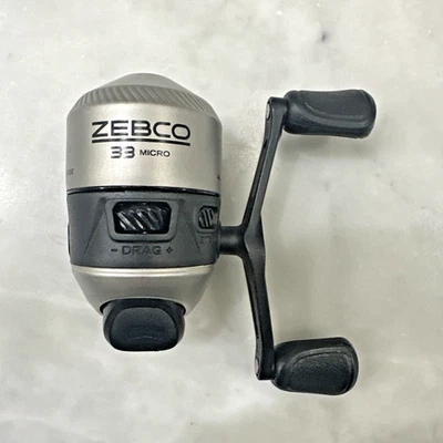 Carrete Spincast Zebco 33, recuperación manual R o L cambiable, con alerta de mordida - usado  Foto 1 de 4