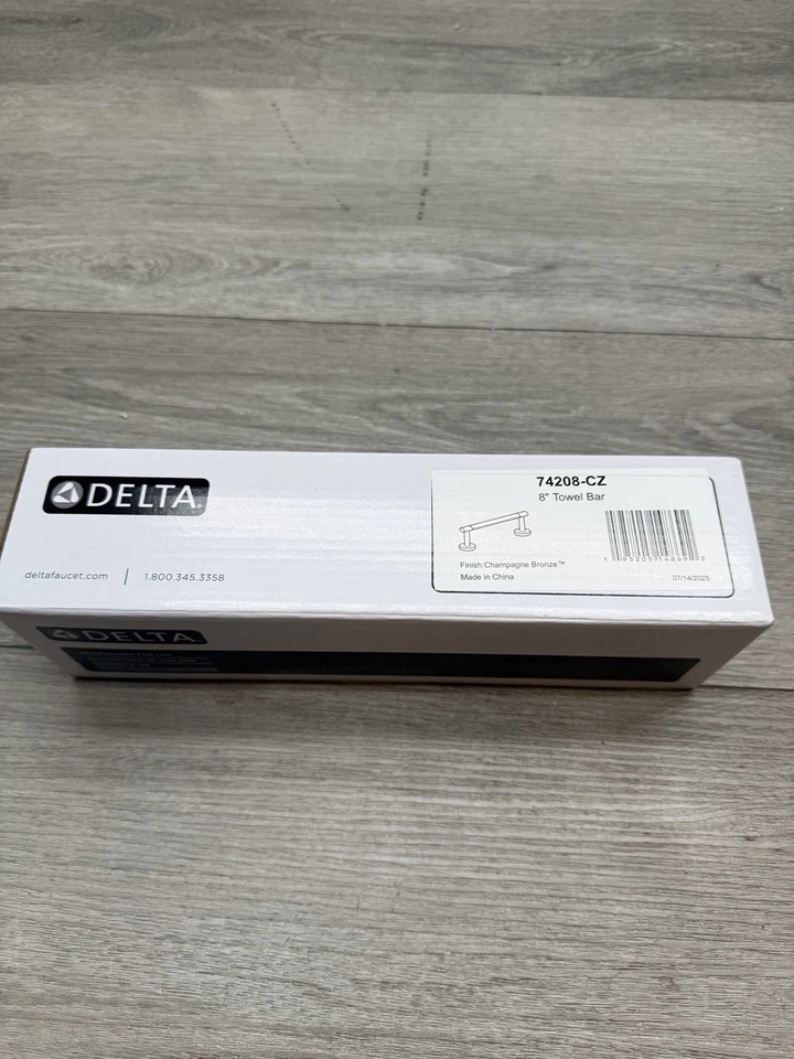 Delta 74208-CZ Altado 8" Toallero Champagne Bronce Foto 1 de 3