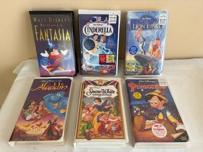 Group of 6 Disney Clamshell VHS Kids Disney Movies - Image 1 of 3