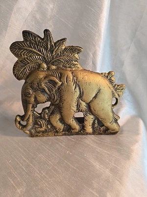 brass-toned elephant door stop or bookend, often crafted from cast iron. - Image 1 of 4