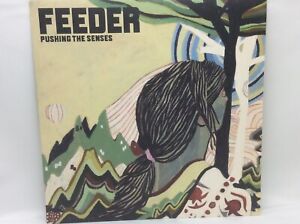 Feeder Pushing the senses 7” single  on white vinyl 