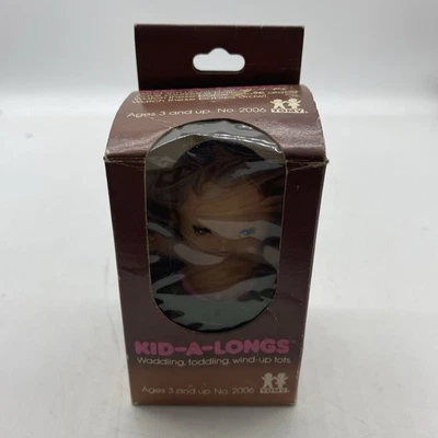 Caminando Bebé Niño-A-Long Niños TOMY No. Juguete de cuerda vintage de 3" 2006 010225AST. 4 Foto 1 de 4