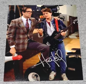 Foto autógrafa firmada personalmente a mano de Huey Lewis de regreso al futuro - Imagen 1 de 2