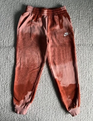 Pantalones deportivos Nike Jogger para niños talla mediana naranja pantalones tie dye polar logotipo cónico Foto 1 de 4