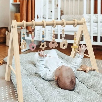 Gimnasio de madera plegable para bebés con 6 juguetes sensoriales para bebés........... A2 Foto 1 de 4