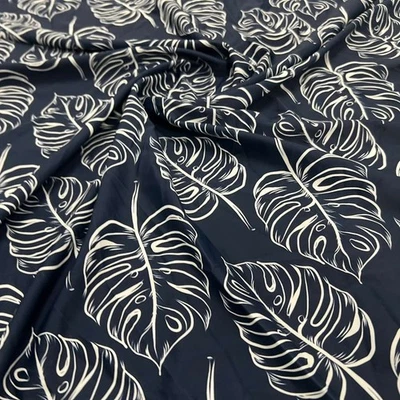 Tela elástica con estampado de fondo negro hojas blancas spandex por yarda para trajes de baño Foto 1 de 4