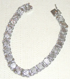 Sterling silver heart bracelet, flexible, non-tarnish finish, weighs 16 grams. - Picture 1 of 2