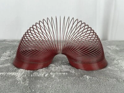 Juguete Slinky de Metal Original Early James Años 40 Rojo Slinky Foto 1 de 2
