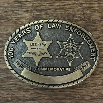 RARO Edición Limitada Hebilla de cinturón vintage 100 años conmemorativa de la ley del sheriff del condado de Orange Foto 1 de 4