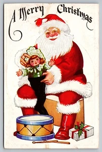 Postcard A Merry Christmas Santa Doll Stocking Drum Present Gift Unposted - Picture 1 of 2