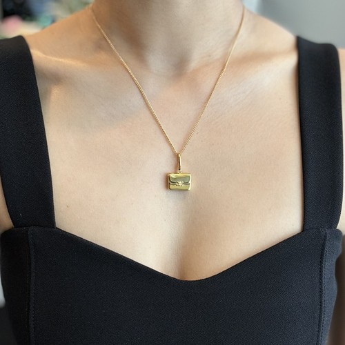 Collana con pedante a borsa CELINE tono oro con scatola