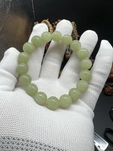 Bracciale in giada gialla etiana 12 mm 新疆和田玉若羌黄口老料黄玉雕刻仿古纹手串 - Foto 1 di 14