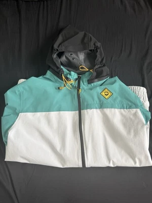 Quebra-vento masculino Outdoor Afro x REI Co-Op tamanho grande, azul amarelo - Imagem 1 de 4