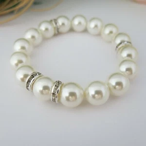 Armband Weiß Perlmutt-Weiß aus Muschelkernperlen 12mm / 20cm mit Zirkoniastein - Bild 1 von 1