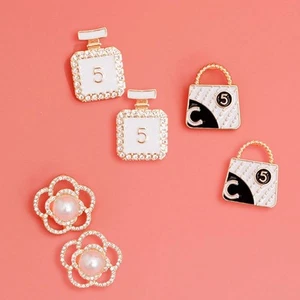 Glamorous Trio: Gold and White Chanel Earrings - Picture 1 of 4