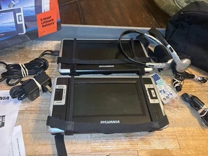 Sylvania 7" Dual Screen Portable DVD Player w/Carry Bag/Remote/Power Supply - Picture 1 of 12