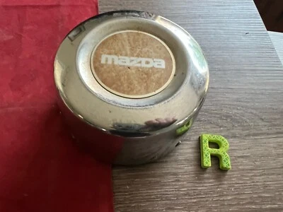 #R 1) 1986-1993 Mazda B-2200 Center Wheel Hub Cap 560-64651 - Image 1 of 4