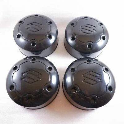 4 PIEZAS TAPA CENTRAL RUEDA SUZUKI SAMURAI JIMNY SIERRA VITARA ESCUDO COMPAÑERO GENUINO Foto 1 de 4