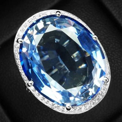 Anillos con halo de oro blanco de plata de ley 925 de 24,20 quilates de tanzanita azul claro prístinos Foto 1 de 4