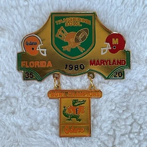 Prendedor conmemorativo de mandarina Florida Gators versus Maryland 1980 - Imagen 1 de 4