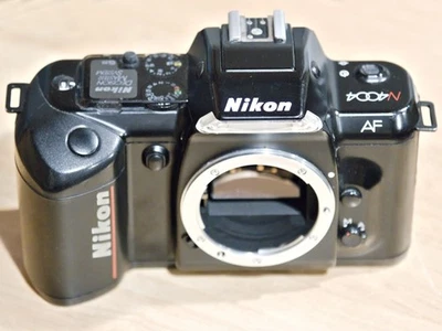 Cámara fotográfica Nikon N4004 sin probar para piezas - pestillo de batería roto Foto 1 de 4