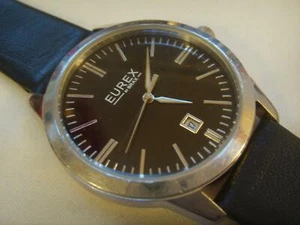 RELOJ EUREX BY BRAX PARA HOMBRES ACERO INOXIDABLE ESFERA NEGRA FECHA CORREA NEGRA RECIENTE - Imagen 1 de 1