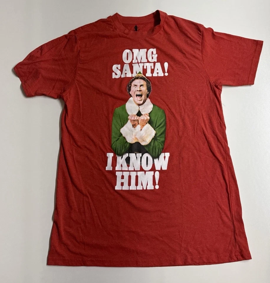 Película de Elfos Hombre Rojo "¡Omg Santa! ¡I Know Him!” Camiseta Mediana Foto 1 de 4