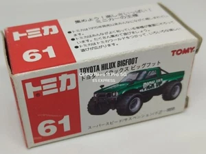 TOMY TOMICA 61 [TOYOTA HILUX BIGFOOT] LOGOTIPO ROJO - Imagen 1 de 5