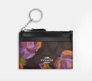 Nuevo con etiquetas.  Estuche Coach Mini Skinny ID en lona exclusiva con estampado de rosas  - Imagen 1 de 4
