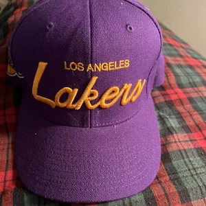 Mitchell & Ness Purple Los Angeles Lakers Gold Script Adjustable Snapback Hat - Picture 1 of 3