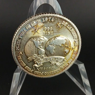 The International Universal Trade Unit 1974 1 oz plata 999 bellamente tonificada  Foto 1 de 4