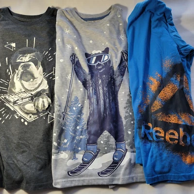 3 Niños Manga Larga: Cat & Jack XL Bulldog DJ Negro, L Oso Esquiador Gris, Reebok XL Foto 1 de 4