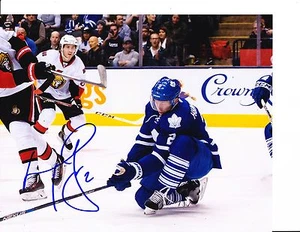 TORONTO MAPLE LEAFS MATT HUNWICK SIGNED BLOCKING SHOT 8X10 - Picture 1 of 1