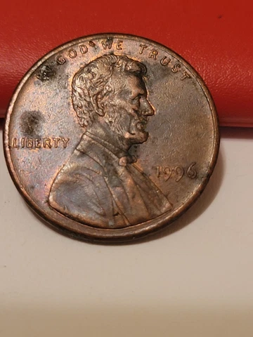 1996 penny lamination peel? struck-through? Joker face obverse Cover