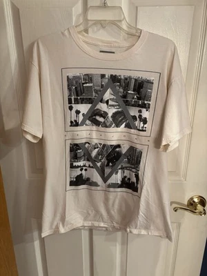 Men’s Sean John T-Shirt. Size Large. Cream Colored With Gray Print. - Image 1 of 3