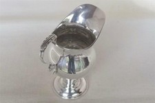 A STUNNING SOLID STERLING SILVER EDWARD VII HELMET SHAPED CREAM JUG CHESTER 1909