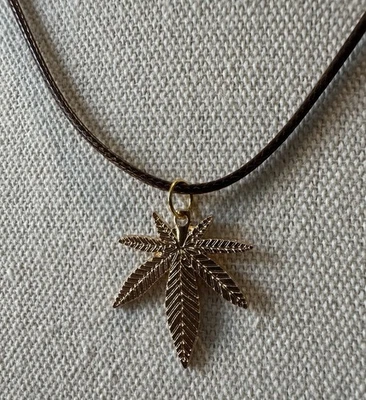 Goldtone Marijuana Pot Cannabis Hemp Pendant On Brown Leather Cord Necklace - Image 1 of 4