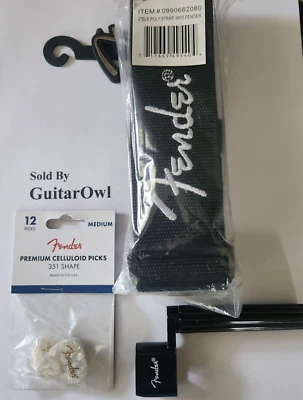 Correa de guitarra Fender logotipo negro/blanco, púas de moto blanco medio/bobinadora de cuerdas Foto 1 de 2