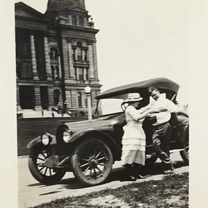 Vintage Snapshot Photograph Man And Woman Next To Car Big Beautiful Building - Picture 1 of 6