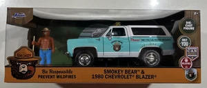 NEW 2025 JADA 1980 CHEVROLET BLAZER & "SMOKEY BEAR" DIECAST FIGURE 1/24 READ - Picture 1 of 3