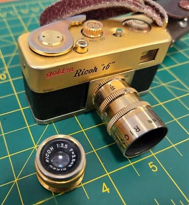 Câmera de Filme Ricoh "16" Dourada com Lente 25mm f/3.5 + Telefoto Ouro RARO 40mm f/5.6 - Imagem 1 de 4