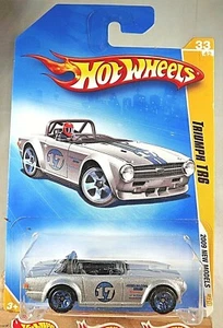 2009 Hot Wheels #33 New Models 33/42 TRIUMPH TR6 Silver Variation w/Blue 5 Spoke - Picture 1 of 5