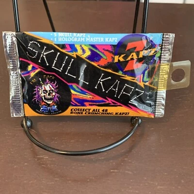 Vintage Sealed Pack Skull Kapz Pogs, 5 Skull Kapz + 1 Holographic Kapz - Image 1 of 4